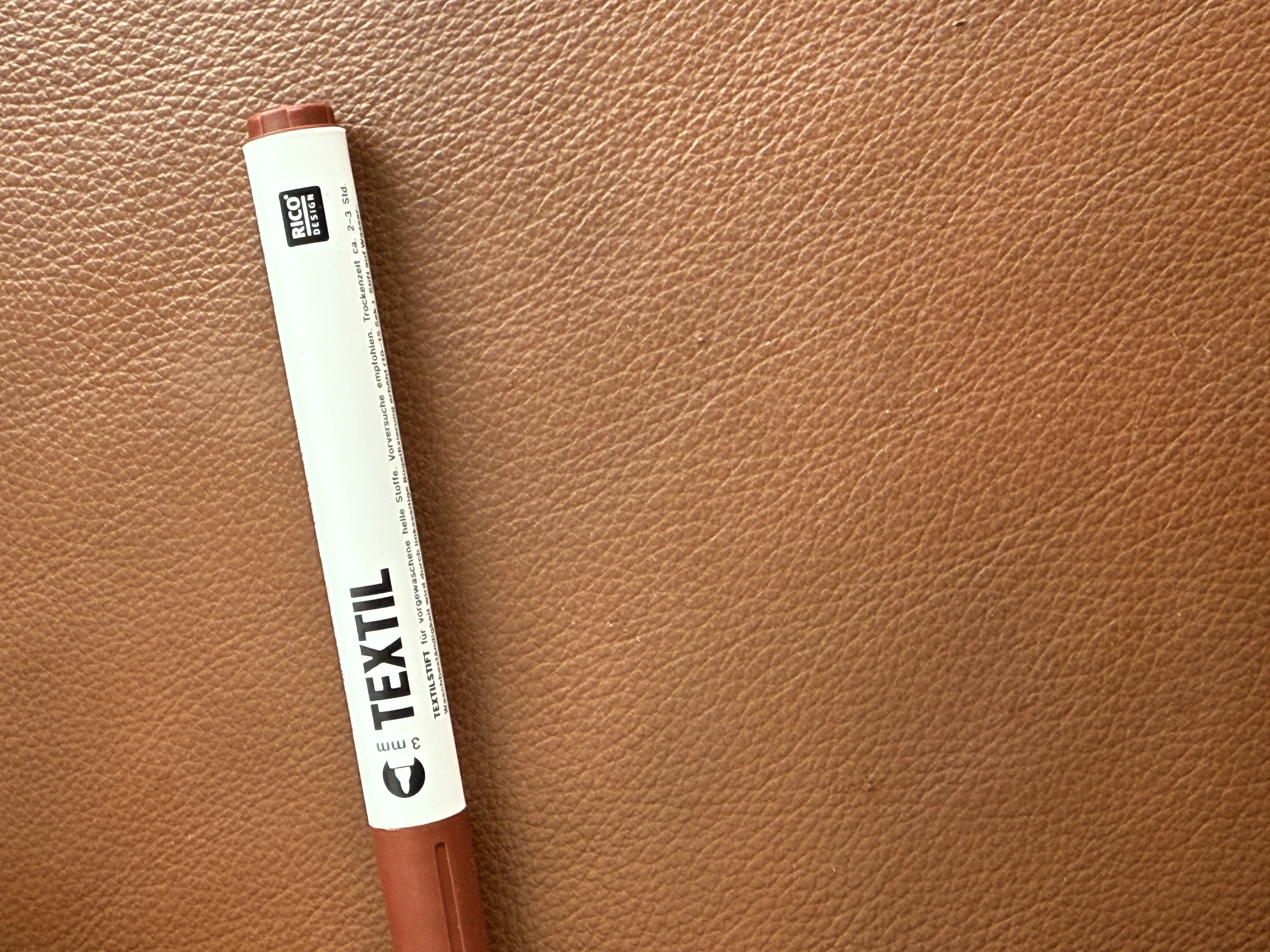 Photo of a scratch-free brown faux leather chair with a fabric marker